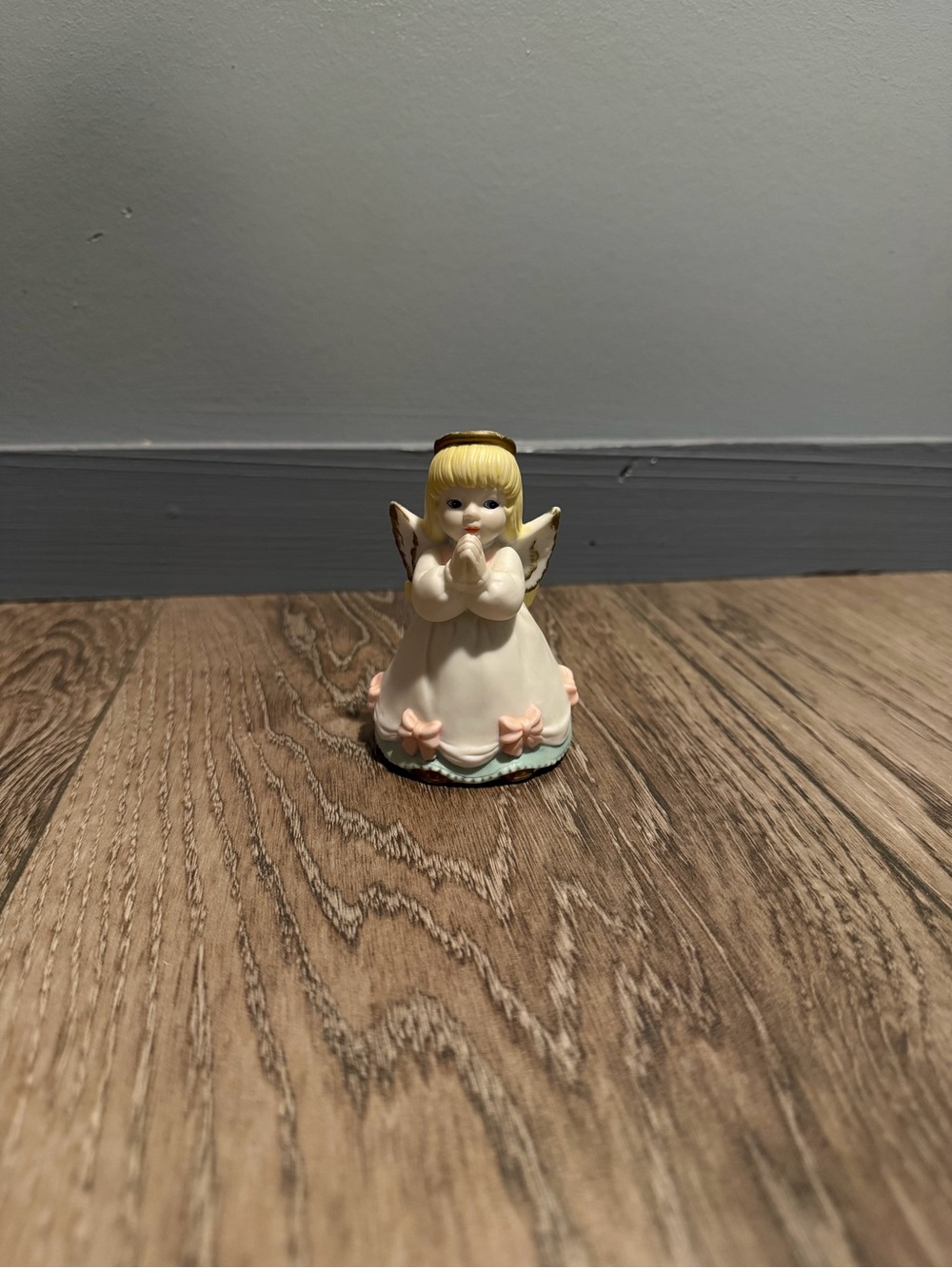 vintage praying angel figurine with music box